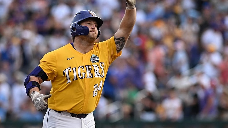 Jun 21, 2023; Omaha, NE, USA;  LSU Tigers designated hitter Cade Beloso (24) reacts after hitting a three run home run against the Wake Forest Demon Deacons in the third inning at Charles Schwab Field Omaha. Mandatory Credit: Steven Branscombe-USA TODAY Sports