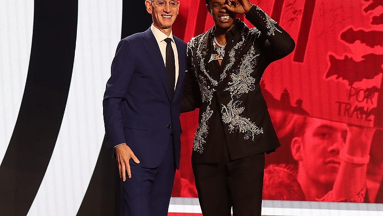 Jun 22, 2023; Brooklyn, NY, USA; Scoot Henderson with NBA commissioner Adam Silver after being selected third by the Portland Trail Blazers in the first round of the 2023 NBA Draft at Barclays Arena. Mandatory Credit: Wendell Cruz-USA TODAY Sports
