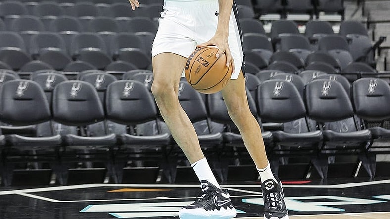 Jun 24, 2023; San Antonio, TX, USA; San Antonio Spurs draft pick Victor Wembanyama shoots around at a press conference at AT&T Center. Mandatory Credit: Troy Taormina-USA TODAY Sports