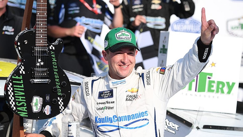 Jun 24, 2023; Nashville, Tennessee, USA; NASCAR Xfinity Series driver AJ Allmendinger (10) and his team celebrate winning the Tennessee Lottery 250 at Nashville Superspeedway. Mandatory Credit: Christopher Hanewinckel-USA TODAY Sports