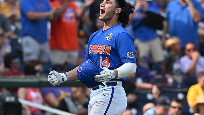 Jun 25, 2023; Omaha, NE, USA;  Florida Gators first baseman Jac Caglianone (14) celebrates hitting a home run against the LSU Tigers in the eighth inning at Charles Schwab Field Omaha. Mandatory Credit: Steven Branscombe-USA TODAY Sports