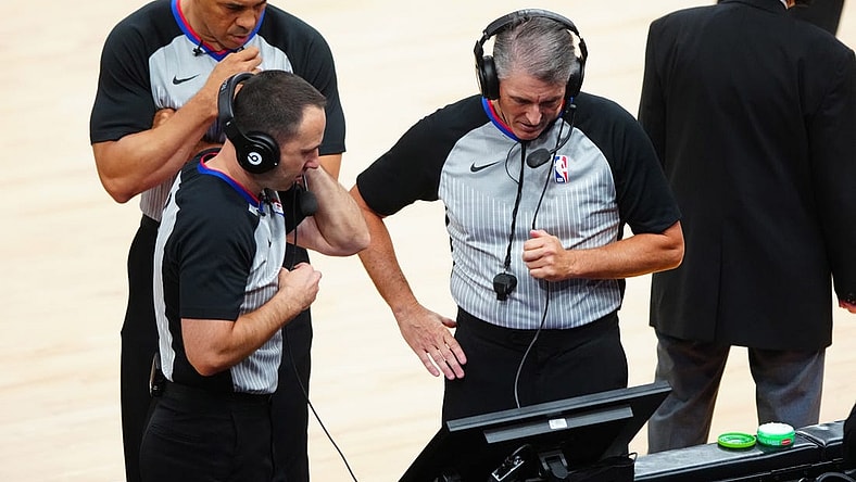 Jun 22, 2021; Phoenix, Arizona, USA; NBA referee Scott Foster (right) with Kane Fitzgerald and Curtis Blair during a video review in the Phoenix Suns against the Los Angeles Clippers during game two of the Western Conference Finals for the 2021 NBA Playoffs at Phoenix Suns Arena. Mandatory Credit: Mark J. Rebilas-USA TODAY Sports