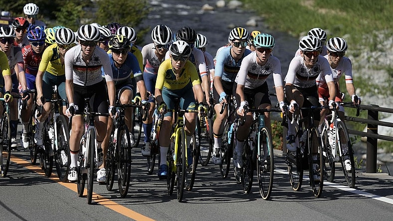 Jul 25, 2021; Shizuoka, Japan; The peloton climbs next to the Doshi River during the Tokyo 2020 Olympic Summer Games at Fuji Speedway. Mandatory Credit: Andrew P. Scott-USA TODAY Network