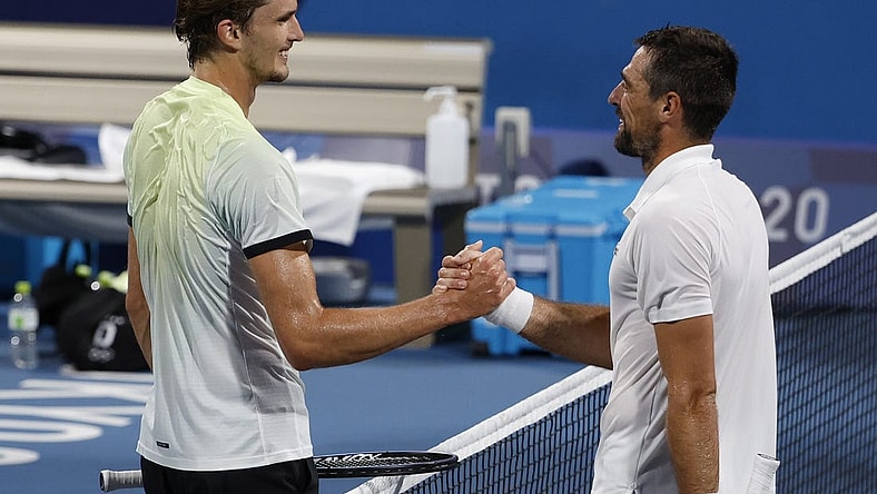 Jul 29, 2021; Tokyo, Japan; Alexander Zverev of Germany (L) shakes hands with Jeremy Chardy of France (R) after their match in a men's singles quarterfinal during the Tokyo 2020 Olympic Summer Games at Ariake Tennis Park. Mandatory Credit: Geoff Burke-USA TODAY Sports