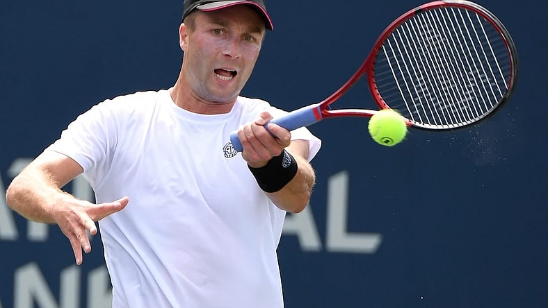 Aug 8, 2021; Toronto, Ontario, Canada; Liam Broady of Great Britain plays a shot against Tommy Paul of the United States during second round qualifying for the National Bank Open. Mandatory Credit: Dan Hamilton-USA TODAY Sports