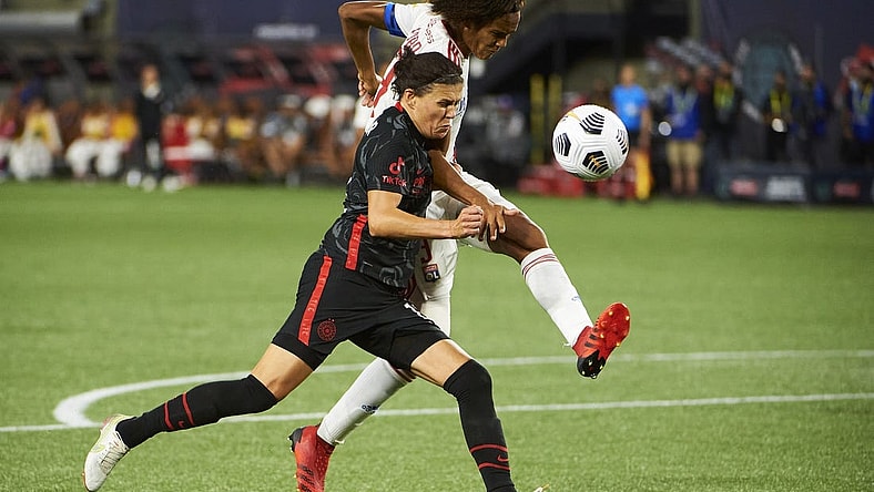 Aug 21, 2021; Portland, OR, USA; Olympique Lyonnais defender Wendie Renard (3) bates for the ball against Portland Thorns FC forward Christine Sinclair (12) during the second half at the Women s International Champions Cup at Providence Park. Portland won 1-0. Mandatory Credit: Troy Wayrynen-USA TODAY Sports
