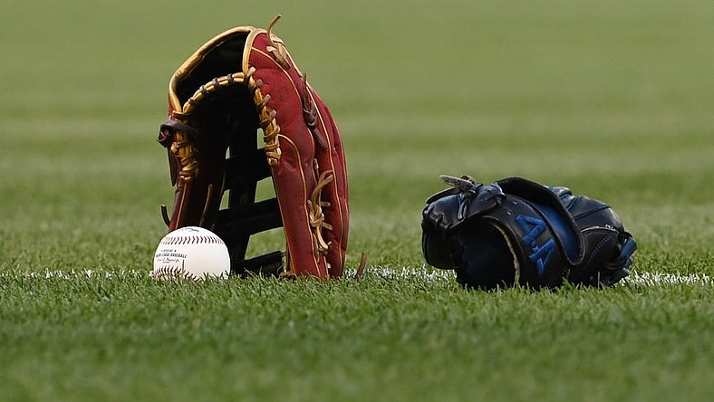 Apr 20, 2022; Washington, District of Columbia, USA;  A detail view of a glove a baseball on the the field before the game between the Washington Nationals and the Arizona Diamondbacks at Nationals Park. Mandatory Credit: Tommy Gilligan-USA TODAY Sports