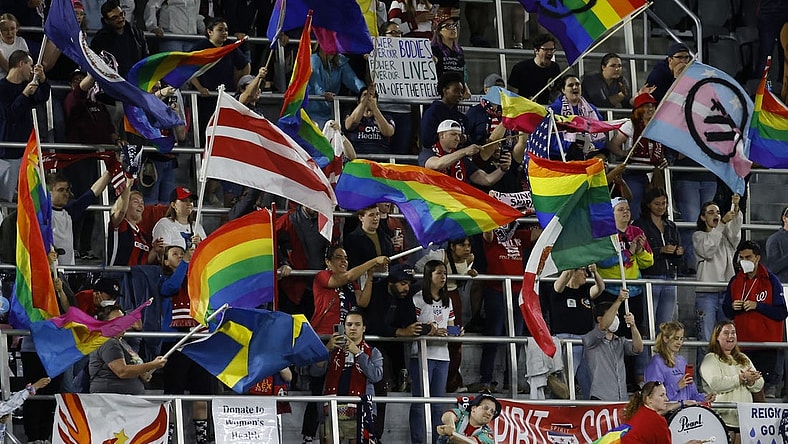 May 4, 2022; Washington, DC, USA; Washington Spirit supporters wave flags in the stands during a penalty kick shootout against OL Reign of a semifinal in the NWSL Challenge Cup at Audi Field. Mandatory Credit: Geoff Burke-USA TODAY Sports