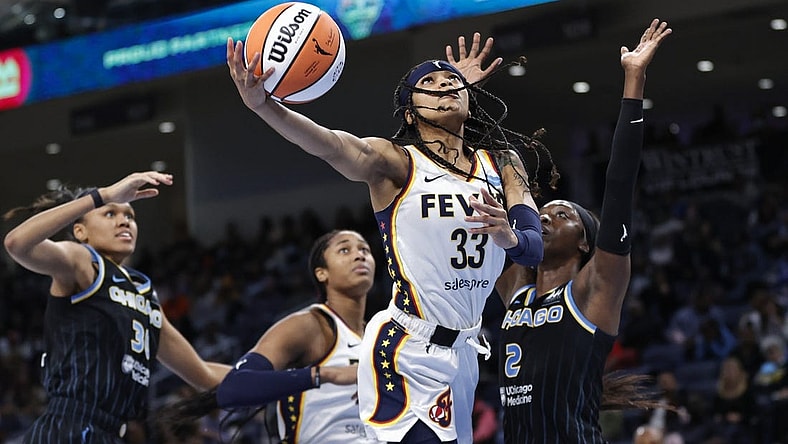 May 24, 2022; Chicago, Illinois, USA; Indiana Fever guard Destanni Henderson (33) goes to the basket against Chicago Sky guard Kahleah Copper (2) during the second half at Wintrust Arena. Mandatory Credit: Kamil Krzaczynski-USA TODAY Sports