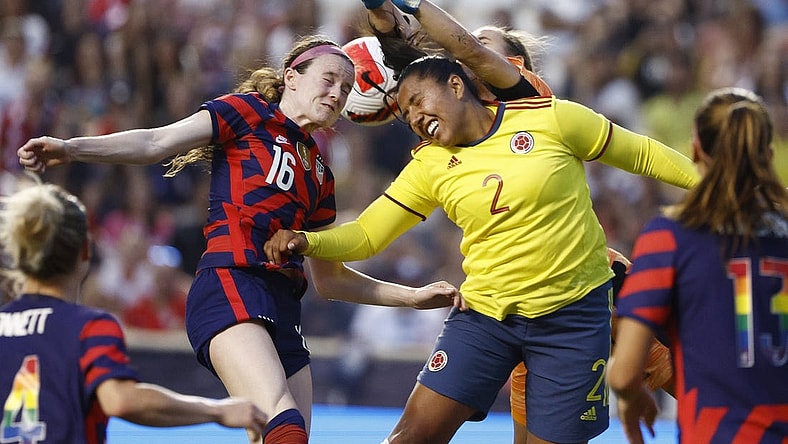 Jun 28, 2022; Sandy, Utah, USA; USA midfielder Rose Lavelle (16) battles Columbia defender Manuela Vanegas (2) and goalkeeper Catalina Perez (1) in the first half during an international friendly soccer match at Rio Tinto Stadium. Mandatory Credit: Jeffrey Swinger-USA TODAY Sports