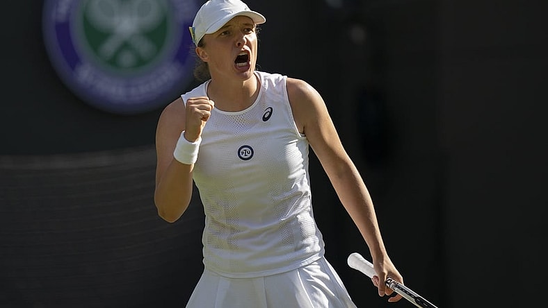 Jun 30, 2022; London, United Kingdom; Iga Swiatek (POL) reacts to a point during her match against Lesley Pattinama Kerkhove (NED) on day four at All England Lawn Tennis and Croquet Club. Mandatory Credit: Susan Mullane-USA TODAY Sports