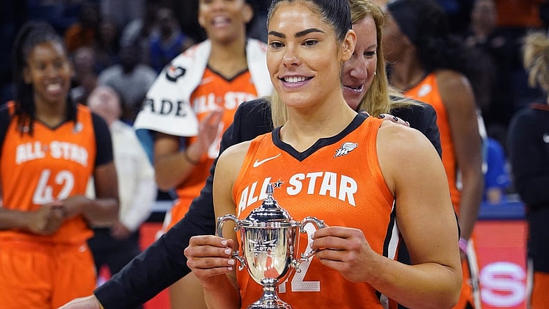 Jul 10, 2022; Chicago, Ill, USA; WNBA Commissioner Cathy Engelbert presents the WNBA All Star Game MVP Award to Team Wilson guard Kelsey Plum at Wintrust Arena. Mandatory Credit: David Banks-USA TODAY Sports