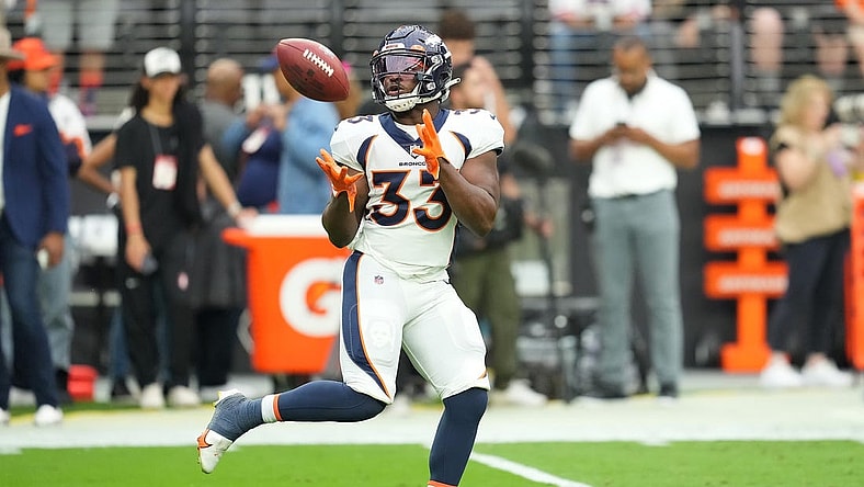 Oct 2, 2022; Paradise, Nevada, USA; Denver Broncos running back Javonte Williams (33) warms up before a game against the Las Vegas Raiders at Allegiant Stadium. Mandatory Credit: Stephen R. Sylvanie-USA TODAY Sports