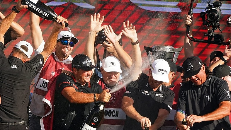 Oct 30, 2022; Miami, Florida, USA; Dustin Johnson , Patrick Reed , Talor Gooch and Pat Perez celebrates team 4Aces GC winning the season finale of the LIV Golf series at Trump National Doral. Mandatory Credit: John David Mercer-USA TODAY Sports