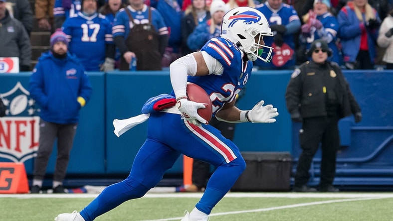 Jan 8, 2023; Orchard Park, New York, USA; Buffalo Bills running back Nyheim Hines (20) returns a kickoff to score a touchdown on the opening play of a game against the New England Patriots at Highmark Stadium. Mandatory Credit: Mark Konezny-USA TODAY Sports