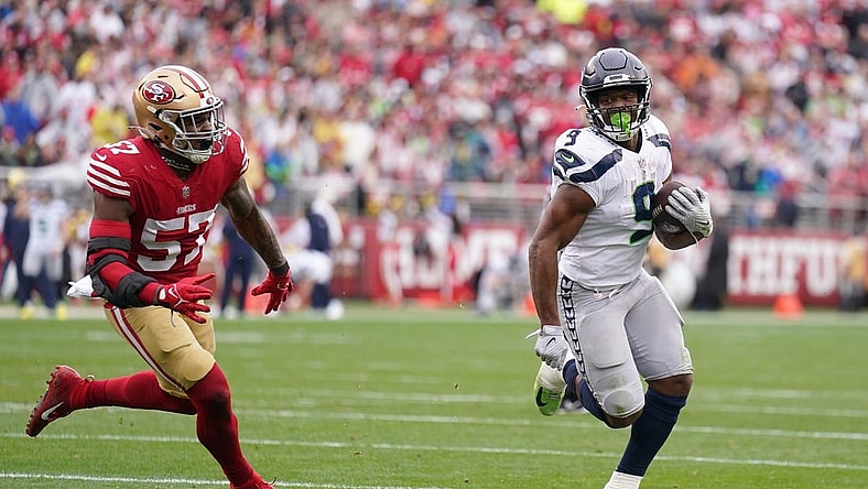 Jan 14, 2023; Santa Clara, California, USA; Seattle Seahawks running back Kenneth Walker III (9) runs away from San Francisco 49ers linebacker Dre Greenlaw (57) for a second quarter touchdown run during a wild card game at Levi's Stadium. Mandatory Credit: Cary Edmondson-USA TODAY Sports