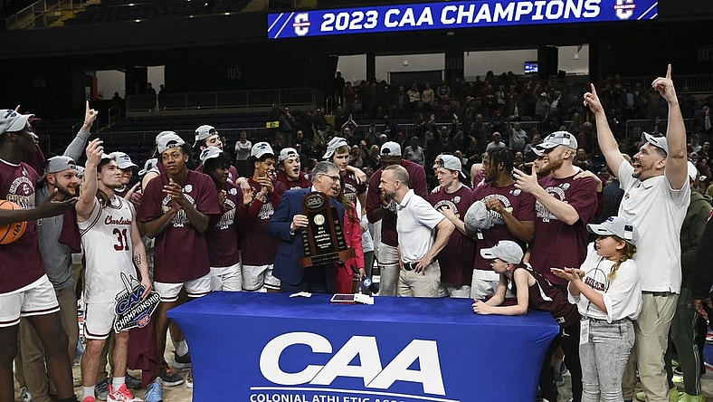 Mar 7, 2023; Washington, D.C., USA;  Colonial Athletic Association commissioner Joe D'Antonio presents Charleston Cougars head coach Pat Kelsey the conference championship trophy after defeating North Carolina-Wilmington Seahawks  at Entertainment & Sports Arena. Mandatory Credit: Tommy Gilligan-USA TODAY Sports