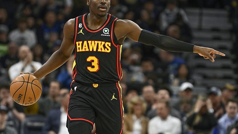 Mar 22, 2023; Minneapolis, Minnesota, USA;  Atlanta Hawks guard Aaron Holiday (3) directs traffic as he controls the ball against the Minnesota Timberwolves in the first quarter at Target Center. Mandatory Credit: Nick Wosika-USA TODAY Sports