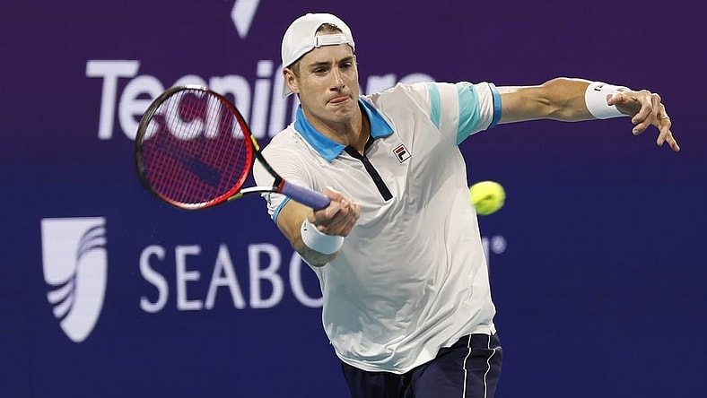 Mar 22, 2023; Miami, Florida, US; John Isner (USA) hits a forehand against Emilio Nara (USA) (not pictured) on day three of the Miami Open at Hard Rock Stadium. Mandatory Credit: Geoff Burke-USA TODAY Sports