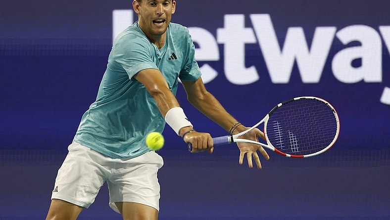 Mar 23, 2023; Miami, Florida, US; Dominic Thiem (AUT) hits a backhand against Lorenzo Sonego (ITA) (not pictured) on day four of the Miami Open at Hard Rock Stadium. Mandatory Credit: Geoff Burke-USA TODAY Sports