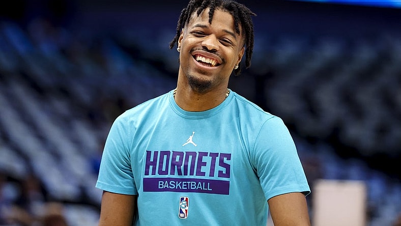 Mar 24, 2023; Dallas, Texas, USA;  Charlotte Hornets guard Dennis Smith Jr. (8) laughs before the game against the Dallas Mavericks at American Airlines Center. Mandatory Credit: Kevin Jairaj-USA TODAY Sports