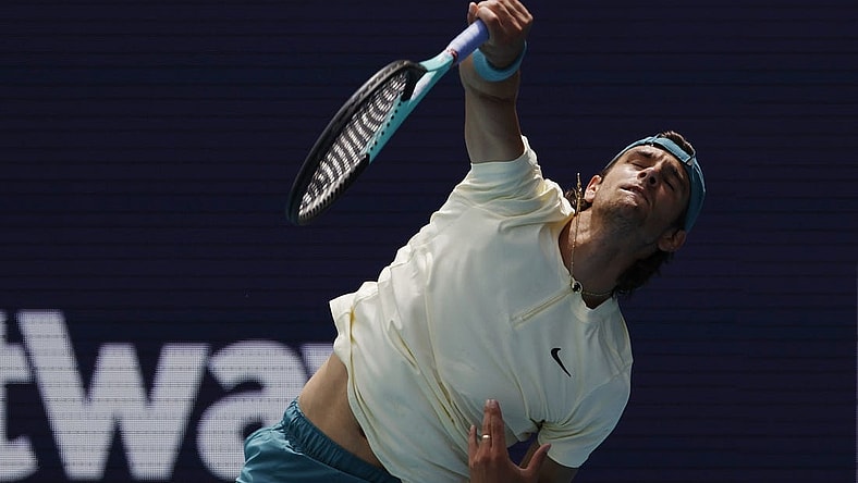 Mar 25, 2023; Miami, Florida, US; Lorenzo Musetti (ITA) serves against Jiri Lehechka (CZE) (not pictured) on day six of the Miami Open at Hard Rock Stadium. Mandatory Credit: Geoff Burke-USA TODAY Sports