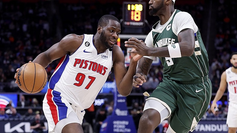 Mar 27, 2023; Detroit, Michigan, USA;  Detroit Pistons forward Eugene Omoruyi (97) dribbles on Milwaukee Bucks forward Bobby Portis (9) in the first half at Little Caesars Arena. Mandatory Credit: Rick Osentoski-USA TODAY Sports