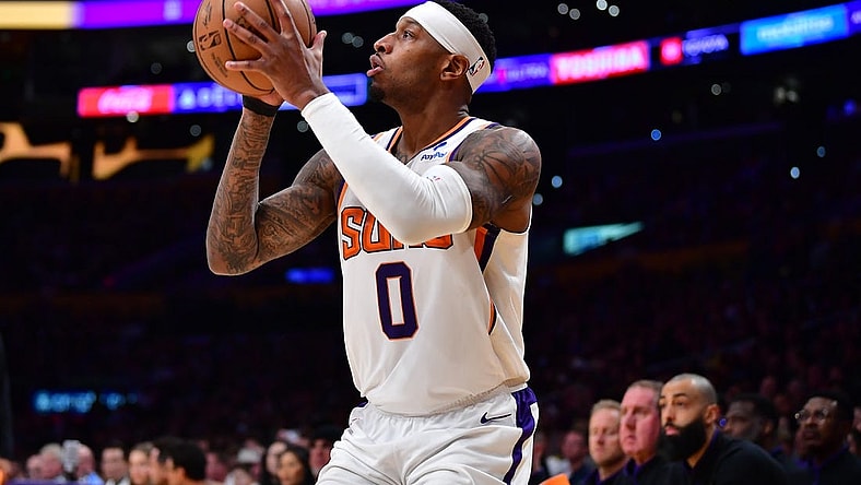 Apr 7, 2023; Los Angeles, California, USA; Phoenix Suns forward Torrey Craig (0) shoots against the Los Angeles Lakers during the second half at Crypto.com Arena. Mandatory Credit: Gary A. Vasquez-USA TODAY Sports