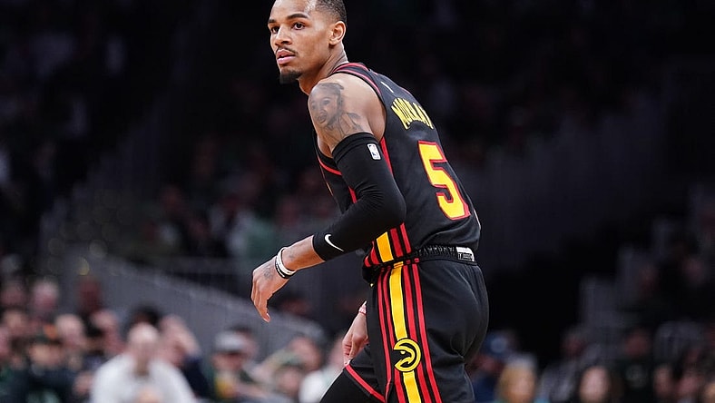 Apr 18, 2023; Boston, Massachusetts, USA; Atlanta Hawks guard Dejounte Murray (5) looks back to the Boston Celtics bench after shooting a three point basket in the third quarter during game two of the 2023 NBA playoffs at TD Garden. Mandatory Credit: David Butler II-USA TODAY Sports