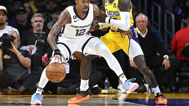 Apr 28, 2023; Los Angeles, California, USA; Los Angeles Lakers guard Dennis Schroder (17) defends Memphis Grizzlies guard Ja Morant (12) in the first half of game six of the 2023 NBA playoffs at Crypto.com Arena. Mandatory Credit: Jayne Kamin-Oncea-USA TODAY Sports