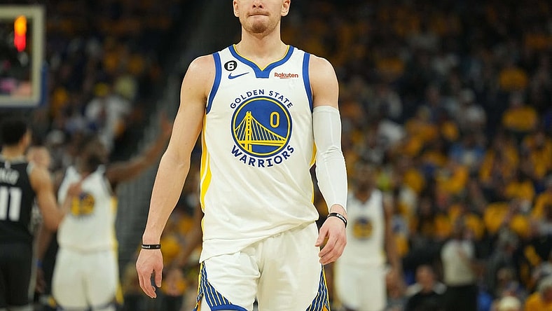 Apr 23, 2023; San Francisco, California, USA; Golden State Warriors guard Donte DiVincenzo (0) during the second quarter of game four of the 2023 NBA playoffs against the Sacramento Kings at Chase Center. Mandatory Credit: Darren Yamashita-USA TODAY Sports