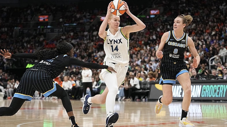 May 13, 2023; Toronto, Ontario, Canada; Minnesota Lynx forward Dorka Juhasz (14) drives past Chicago Sky guard Kahleah Copper (2) and forward Alanna Smith (8) during the second half at Scotiabank Arena. Mandatory Credit: John E. Sokolowski-USA TODAY Sports