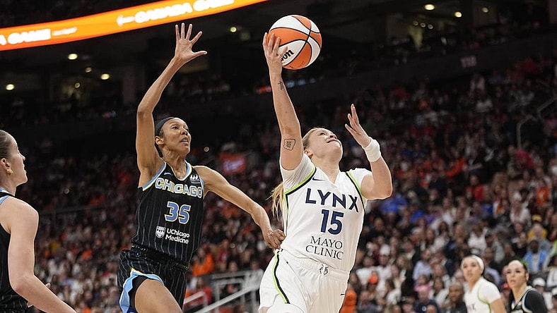 May 13, 2023; Toronto, Ontario, Canada; Minnesota Lynx guard Rachel Banham (15) goes up to make a basket as Chicago Sky guard Rebekah Gardner (35) pursues during the second half at Scotiabank Arena. Mandatory Credit: John E. Sokolowski-USA TODAY Sports