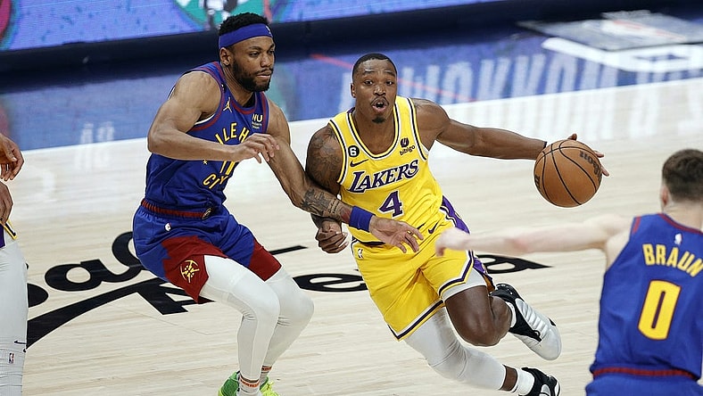 May 16, 2023; Denver, Colorado, USA; Los Angeles Lakers guard Lonnie Walker IV (4) controls the ball against Denver Nuggets forward Bruce Brown (11) in the second half during game one of the Western Conference Finals for the 2023 NBA playoffs at Ball Arena. Mandatory Credit: Isaiah J. Downing-USA TODAY Sports