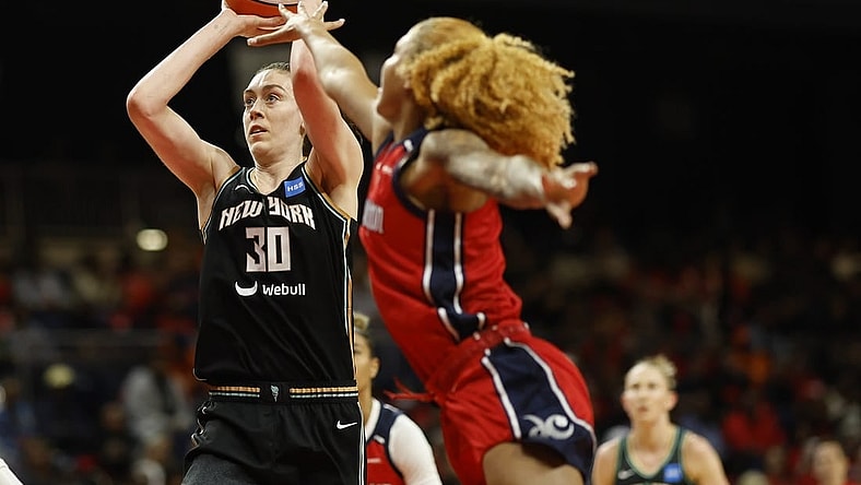 May 19, 2023; Washington, District of Columbia, USA; New York Liberty forward Breanna Stewart (30) shoots the ball as Washington Mystics center Shakira Austin (0) defends at Entertainment & Sports Arena. Mandatory Credit: Geoff Burke-USA TODAY Sports