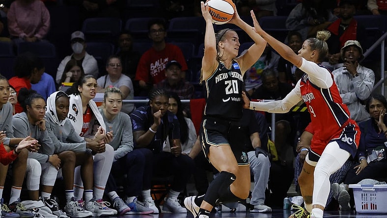 May 19, 2023; Washington, District of Columbia, USA; New York Liberty guard Sabrina Ionescu (20) holds the ball as Washington Mystics guard Natasha Cloud (9) defends at Entertainment & Sports Arena. Mandatory Credit: Geoff Burke-USA TODAY Sports