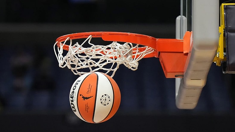 May 25, 2023; Los Angeles, California, USA; Wilson official basketball with WNBA logo goes through the net during the game between the LA Sparks and the Las Vegas Aces at Crypto.com Arena. Mandatory Credit: Kirby Lee-USA TODAY Sports