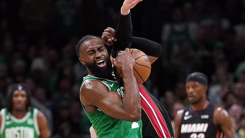 May 29, 2023; Boston, Massachusetts, USA; Boston Celtics guard Jaylen Brown (7) battles for control against Miami Heat guard Max Strus (31) in the first quarter during game seven of the Eastern Conference Finals for the 2023 NBA playoffs at TD Garden. Mandatory Credit: David Butler II-USA TODAY Sports