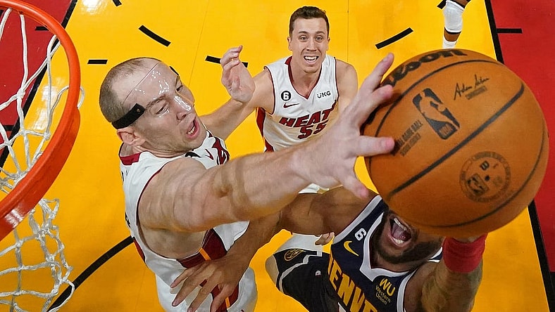 Jun 9, 2023; Miami, Florida, USA; Miami Heat center Cody Zeller (44) blocks the shot of Denver Nuggets forward Bruce Brown (11) during the first half in game four of the 2023 NBA Finals at Kaseya Center. Mandatory Credit: Kyle Terada-USA TODAY Sports