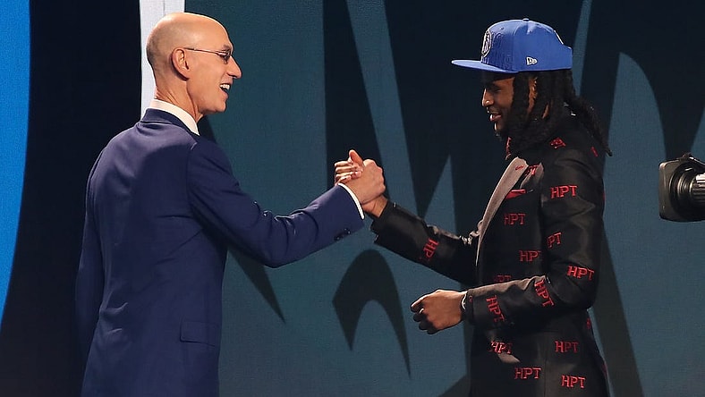 Jun 22, 2023; Brooklyn, NY, USA; Cason Wallace (Kentucky) is greeted by NBA commissioner Adam Silver after being selected tenth by the Dallas Mavericks in the first round of the 2023 NBA Draft at Barclays Arena. Mandatory Credit: Wendell Cruz-USA TODAY Sports