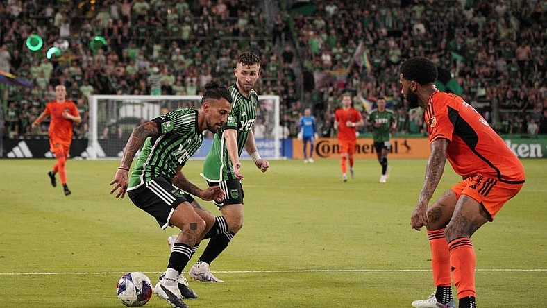 Jun 24, 2023; Austin, Texas, USA; Austin FC defender Amro Tarek (31) dribbles the ball against the Houston Dynamo defender Micael (31) during the second half at Q2 Stadium. Mandatory Credit: Dustin Safranek-USA TODAY Sports