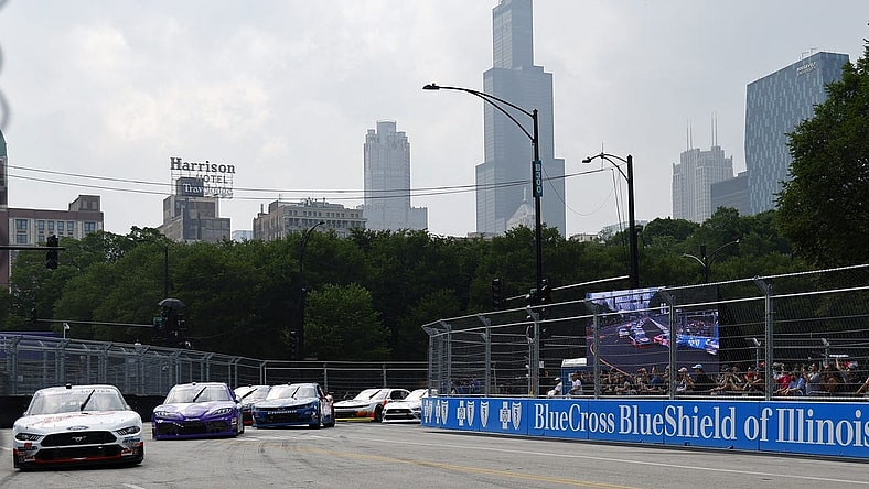 Jul 1, 2023; Chicago, Illinois, USA; Xfinity Series driver Cole Custer (00) leads the field along Grant Park during The Loop 121 of the Chicago Street Race. Mandatory Credit: Mike Dinovo-USA TODAY Sports
