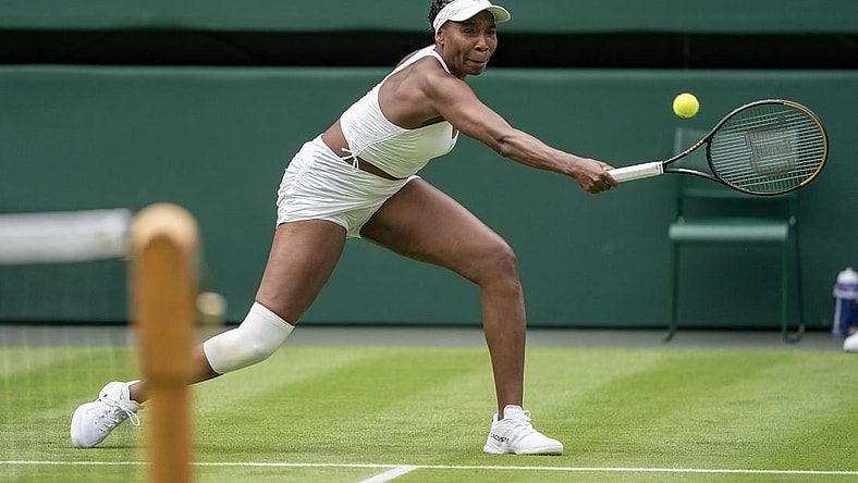 Jul 3, 2023; London, United Kingdom; Elina Svitolina (UKR) returns the ball against Venus Williams (USA) at the All England Lawn Tennis and Croquet Club. Mandatory Credit: Susan Mullane-USA TODAY Sports