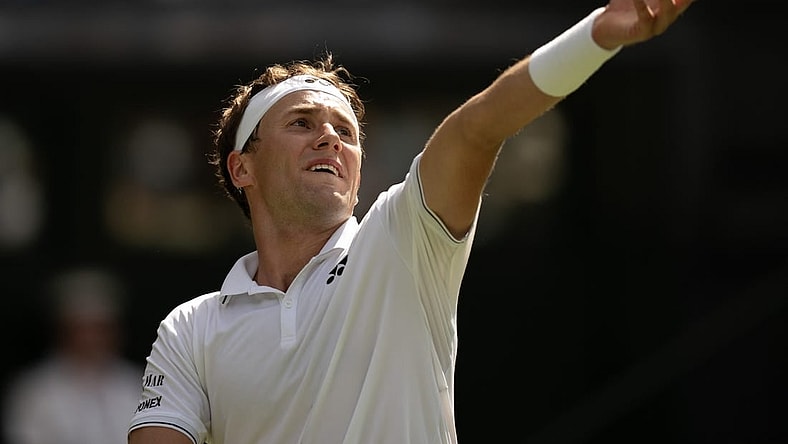 Jul 6, 2023; London, United Kingdom; Casper Ruud (NOR) tosses the ball to serve during his match against Liam Broady (GBR) on day four at the All England Lawn Tennis and Croquet Club.  Mandatory Credit: Susan Mullane-USA TODAY Sports