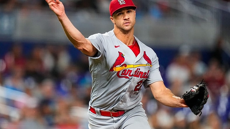 Jul 6, 2023; Miami, Florida, USA; St. Louis Cardinals starting pitcher Jack Flaherty (22) throws the ball to first base against the Miami Marlins during the seventh inning at loanDepot Park. Mandatory Credit: Rich Storry-USA TODAY Sports