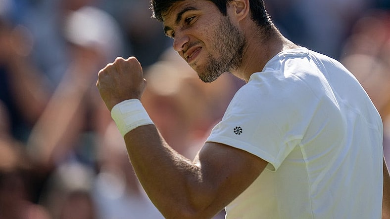 Jul 7, 2023; London, United Kingdom; Carlos Alcaraz (ESP) celebrates winning his match against Alexandre Muller (FRA) on day five of Wimbledon at the All England Lawn Tennis and Croquet Club.  Mandatory Credit: Susan Mullane-USA TODAY Sports