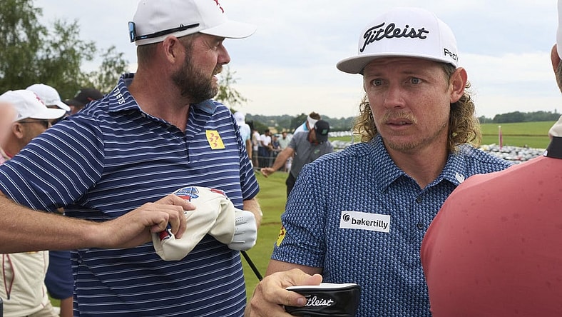 Jul 8, 2023; Hertfordshire, England, GBR; Leaders Cameron Smith (AUS) and Marc Leishman (AUS) practice on the range before the second round of the LIV Golf London golf tournament at Centurion Club. Mandatory Credit: Peter van den Berg-USA TODAY Sports