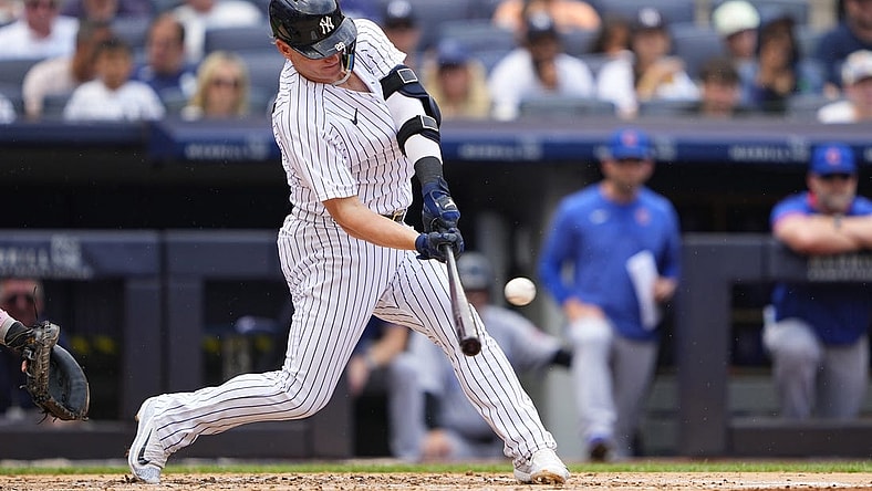 Jul 8, 2023; Bronx, New York, USA; New York Yankees designated hitter Josh Donaldson (28) hits a home run against the Chicago Cubs during the second inning at Yankee Stadium. Mandatory Credit: Gregory Fisher-USA TODAY Sports
