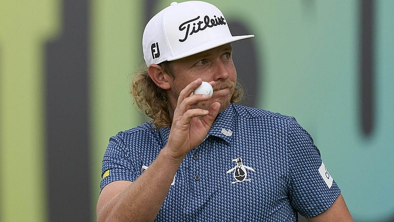 Jul 8, 2023; Hertfordshire, England, GBR; Cameron Smith (AUS) acknowledges the crowd on the 18th green during the second round of the LIV Golf London golf tournament at Centurion Club. Mandatory Credit: Peter van den Berg-USA TODAY Sports