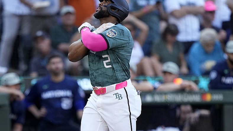 Jul 11, 2023; Seattle, Washington, USA; American League first baseman  Yandy Diaz  of the Tampa Bay Rays (2) reacts after hitting a home run during the second inning at T-Mobile Park. Mandatory Credit: Stephen Brashear-USA TODAY Sports